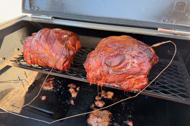 Pulled pork in the making: two shoulders on the smoker