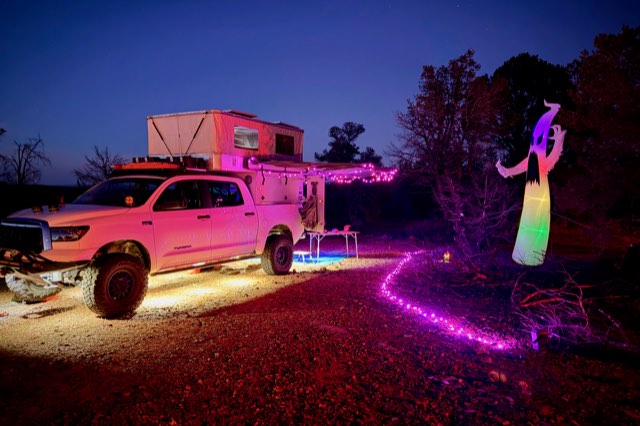 Camp with purple lights and an inflatable ghost